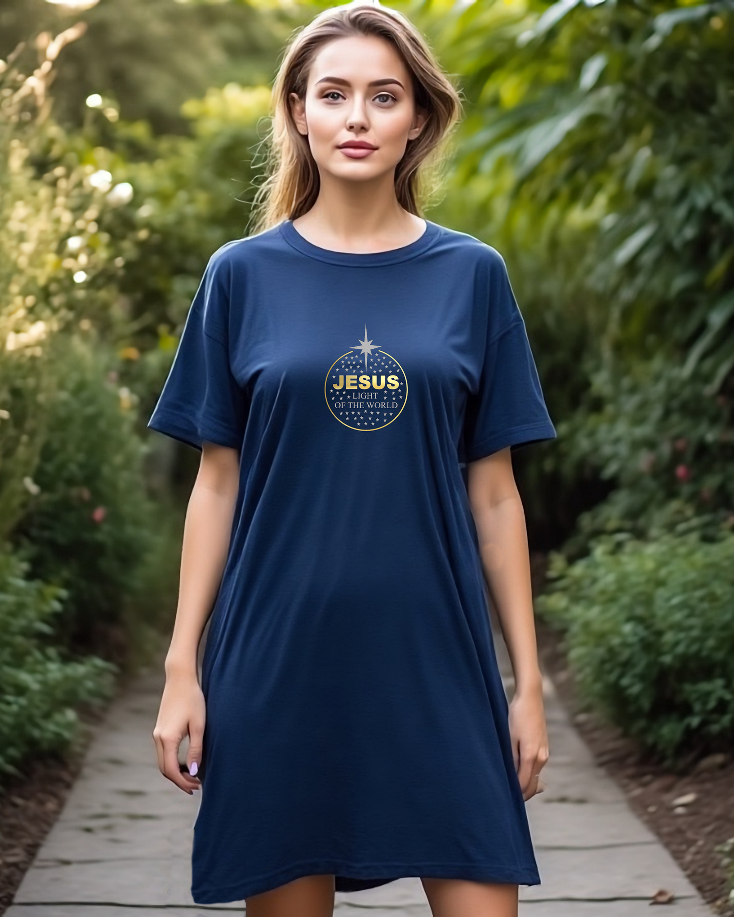 Woman wearing a navy blue t-shirt with a 'Jesus' graphic in a garden setting