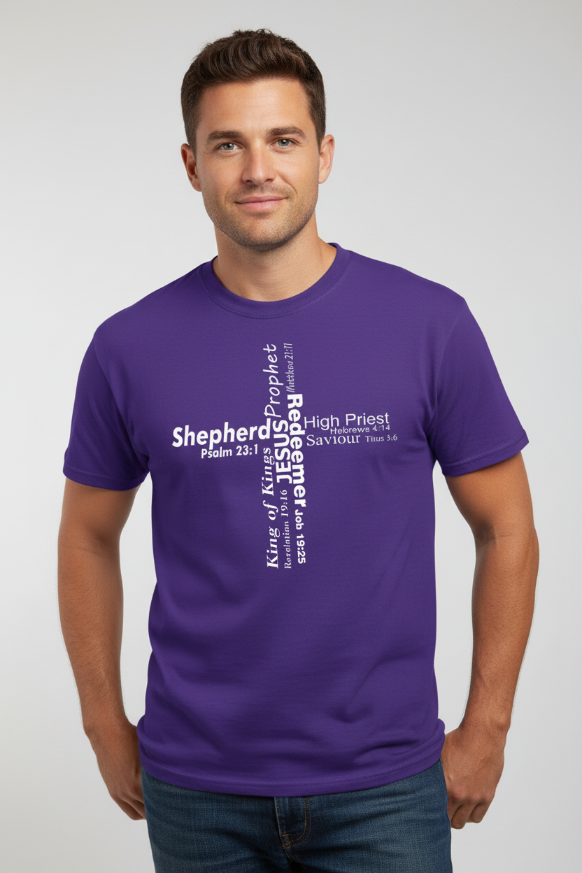 A man wearing purple short-sleeve crewneck t-shirt against a light gray wall. The front of the shirt features a white typographic cross design with the various roles of Jesus.