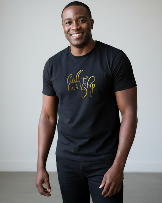 A man wearing a black t-shirt with a Heavenly Dreamwear designed "Calll to Worship" logo printed in gold on the front.