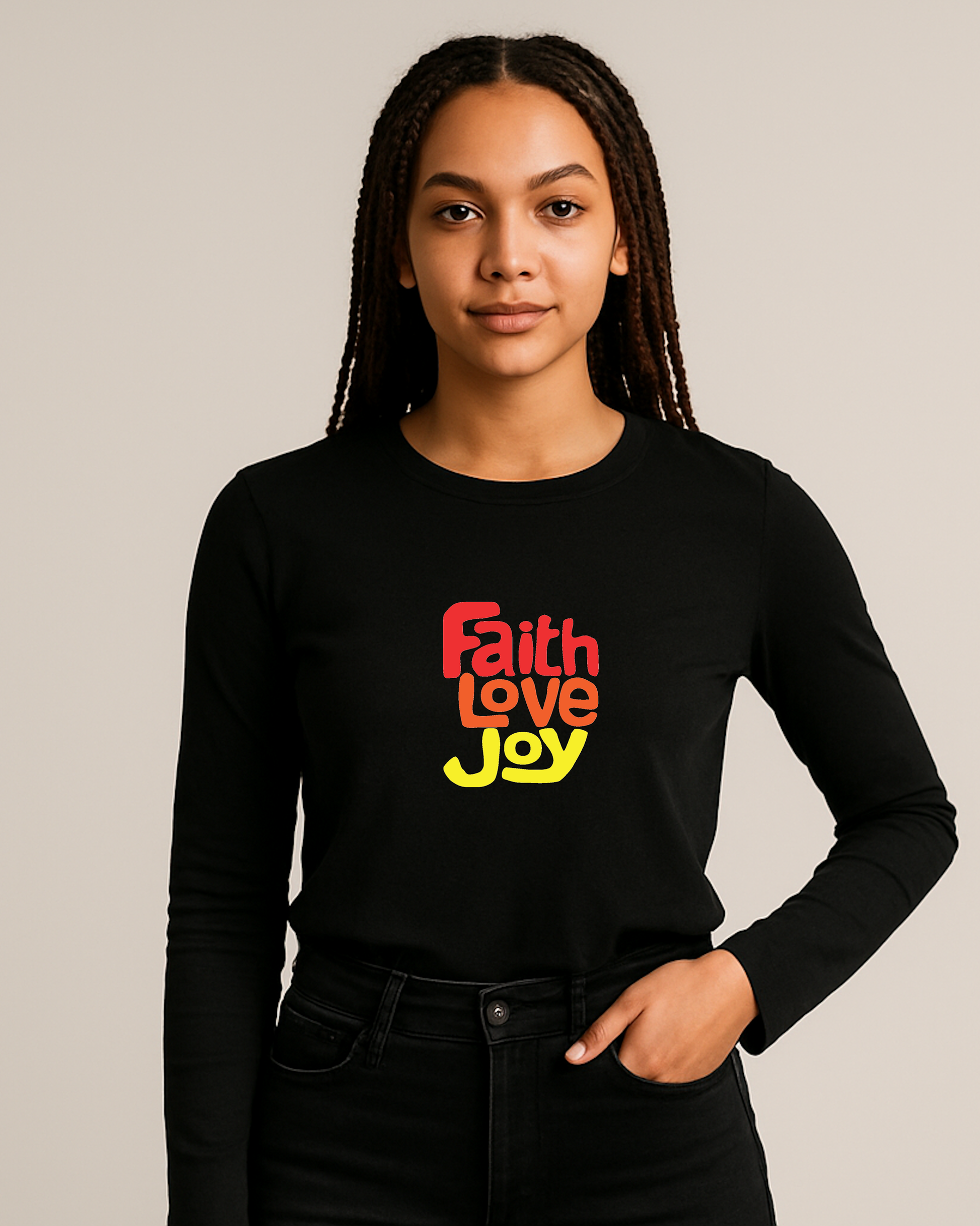 Woman wearing a black long-sleeve shirt with 'Faith Love Joy' text in red, orange, and yellow on a plain background.