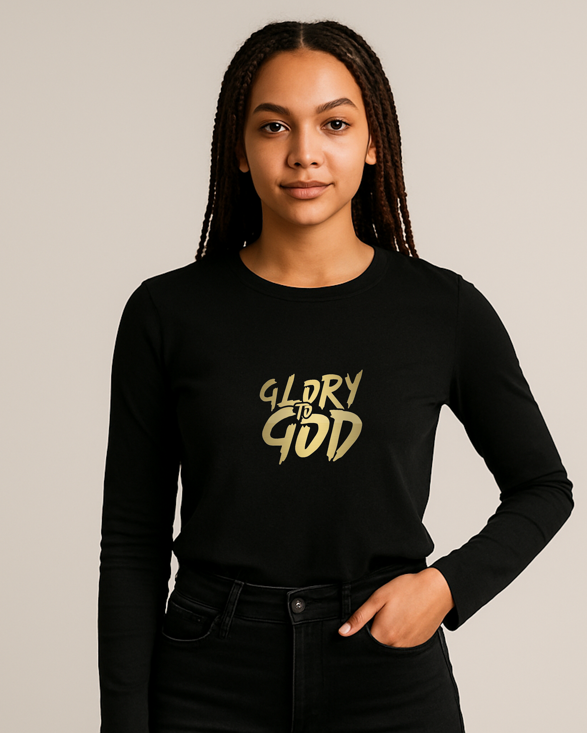 A woman wearing a black long-sleeve shirt with 'GLORY TO GOD' in gold letters on a plain background
