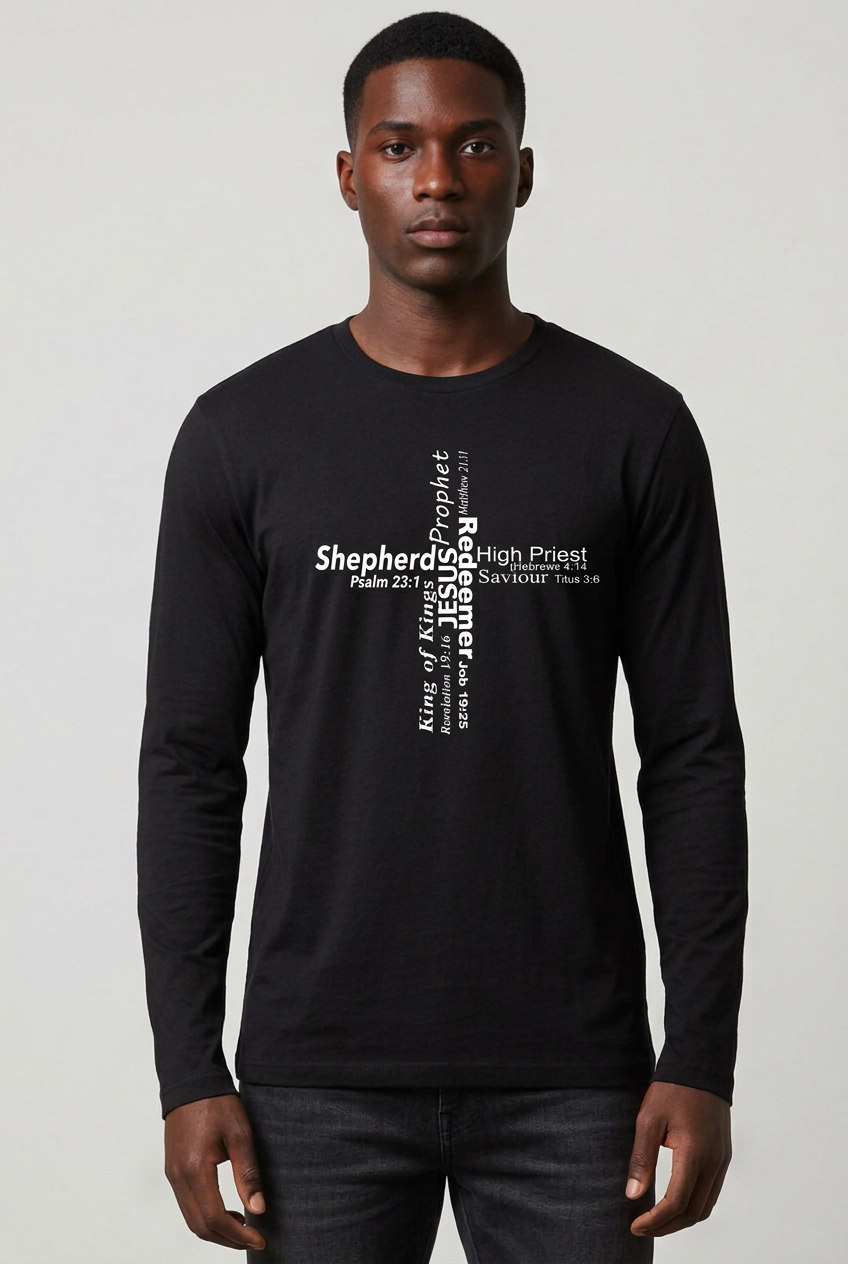 A man wearing a black long-sleeve t-shirt with a white typographic cross graphic made from words stating the roles of Jesus on the chest, standing against a light gray studio background.
