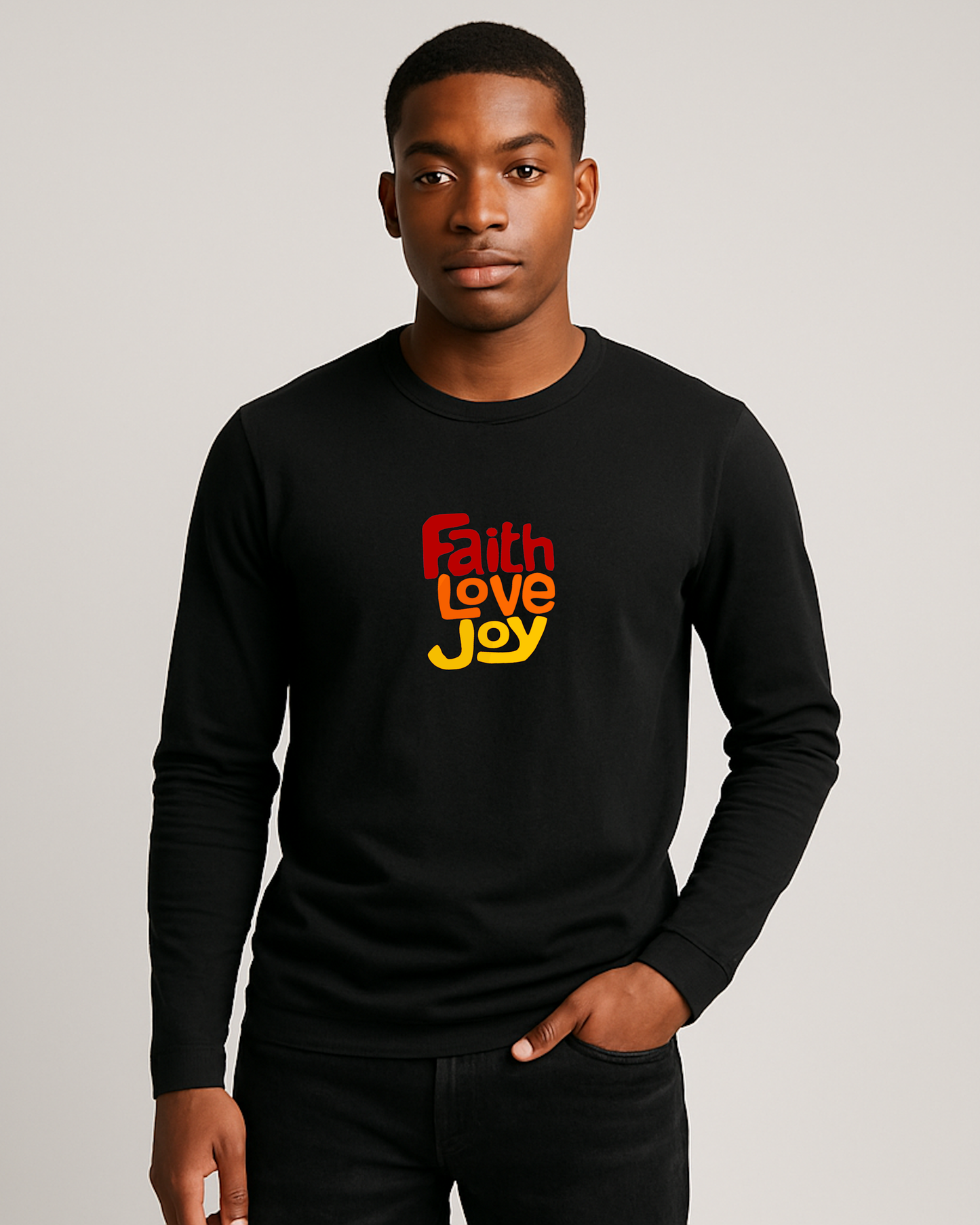 Man wearing a black sweatshirt with 'Faith Love Joy' text on a gray background