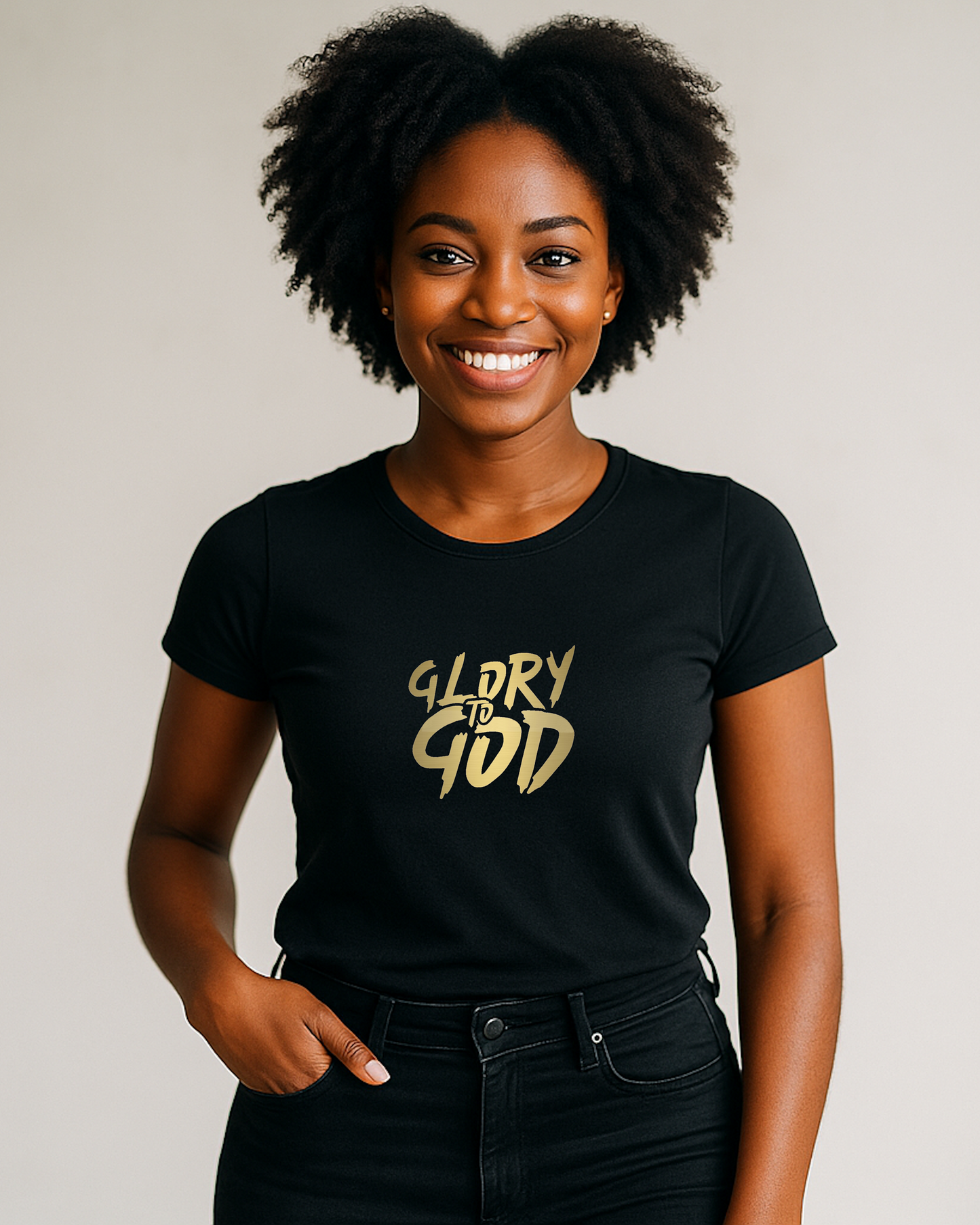 A woman wearing a black t-shirt with a gold Heavenly Dreamwear "Glory to God" logo printed on the front.