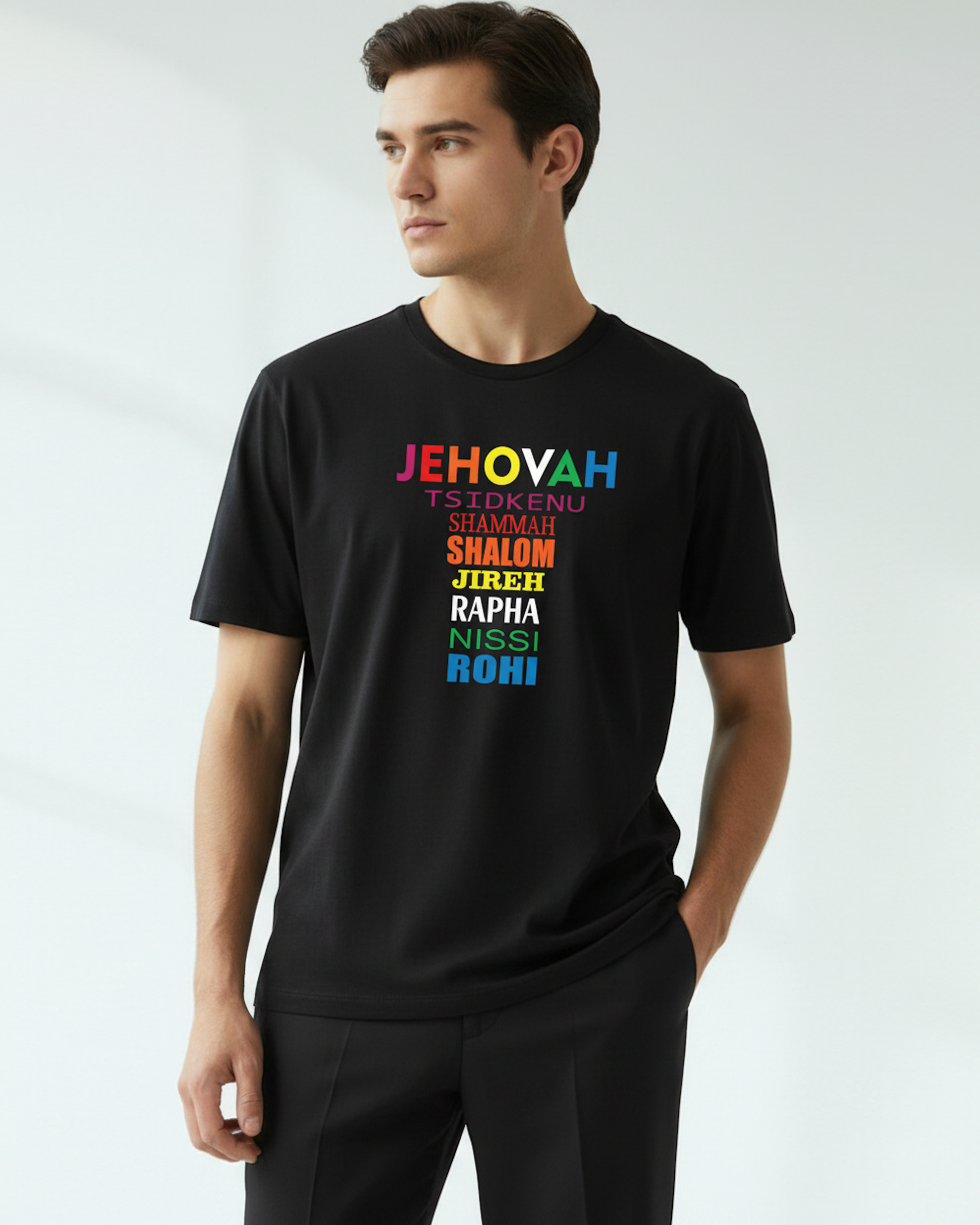Man wearing a black t-shirt with colorful text printed on the front on a white background