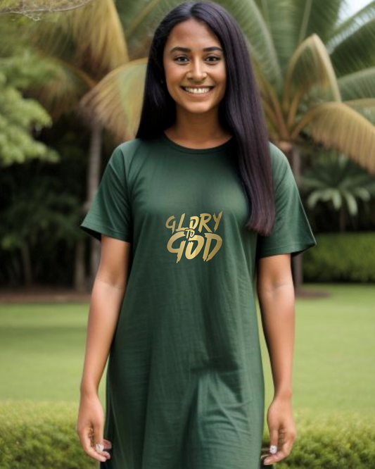Woman in a garden wearing a green t-shirt with gold 'Glory God' text printed on the front.