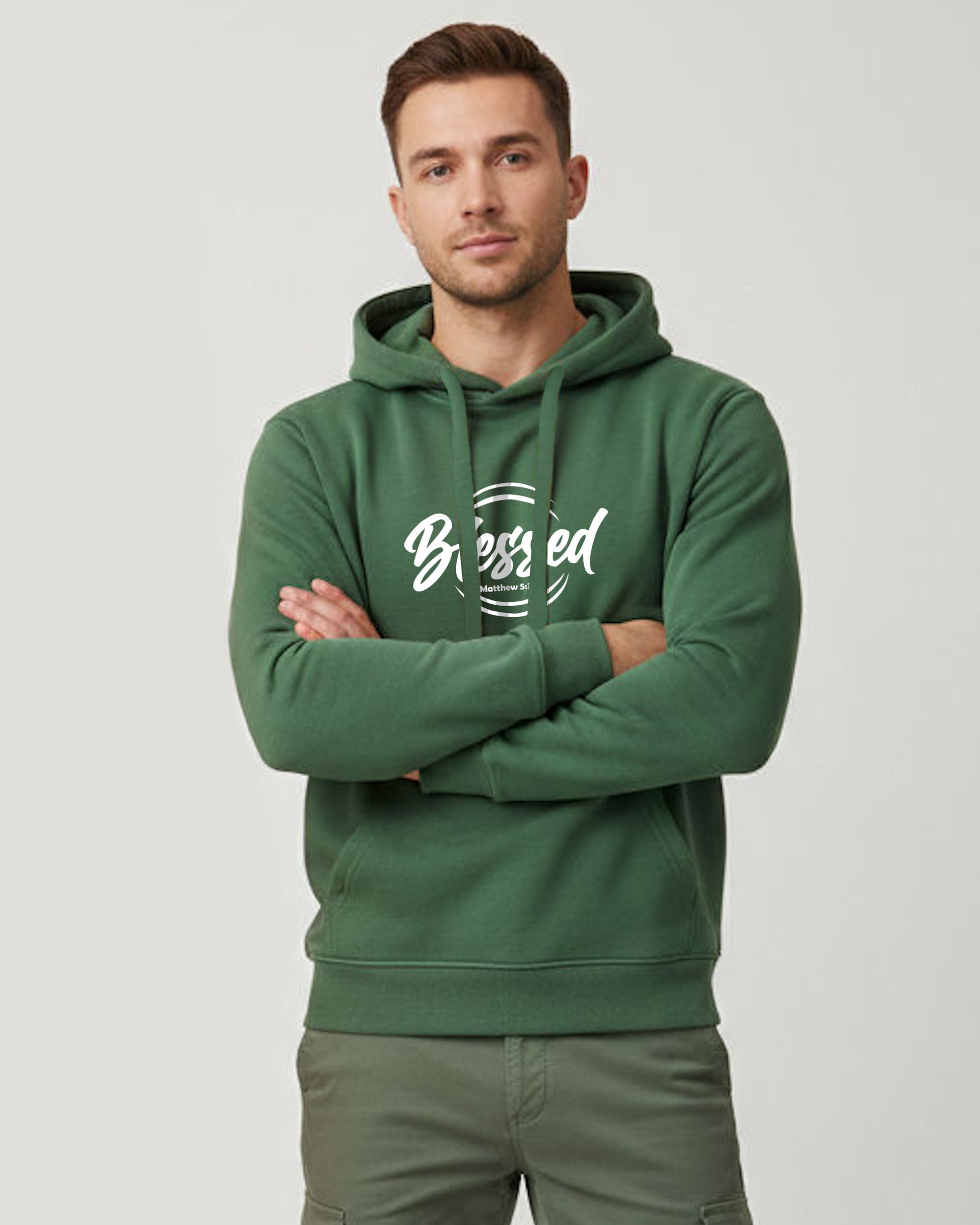 Man wearing a green hoodie with 'Blessed' text on a light gray background