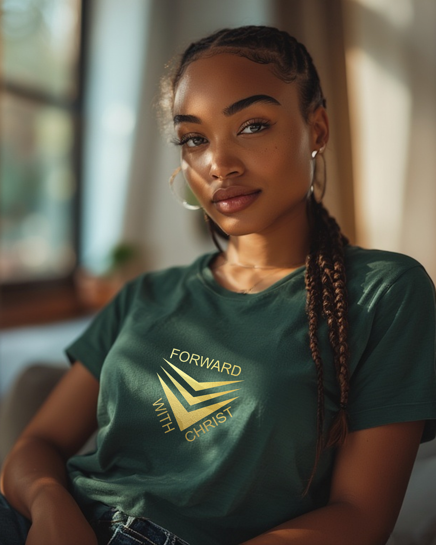 A woman wearing a green short sleeve t-shirt that has a gold logo with the words "FORWARD WITH CHRIST" around 3 downward pointing chevrons.