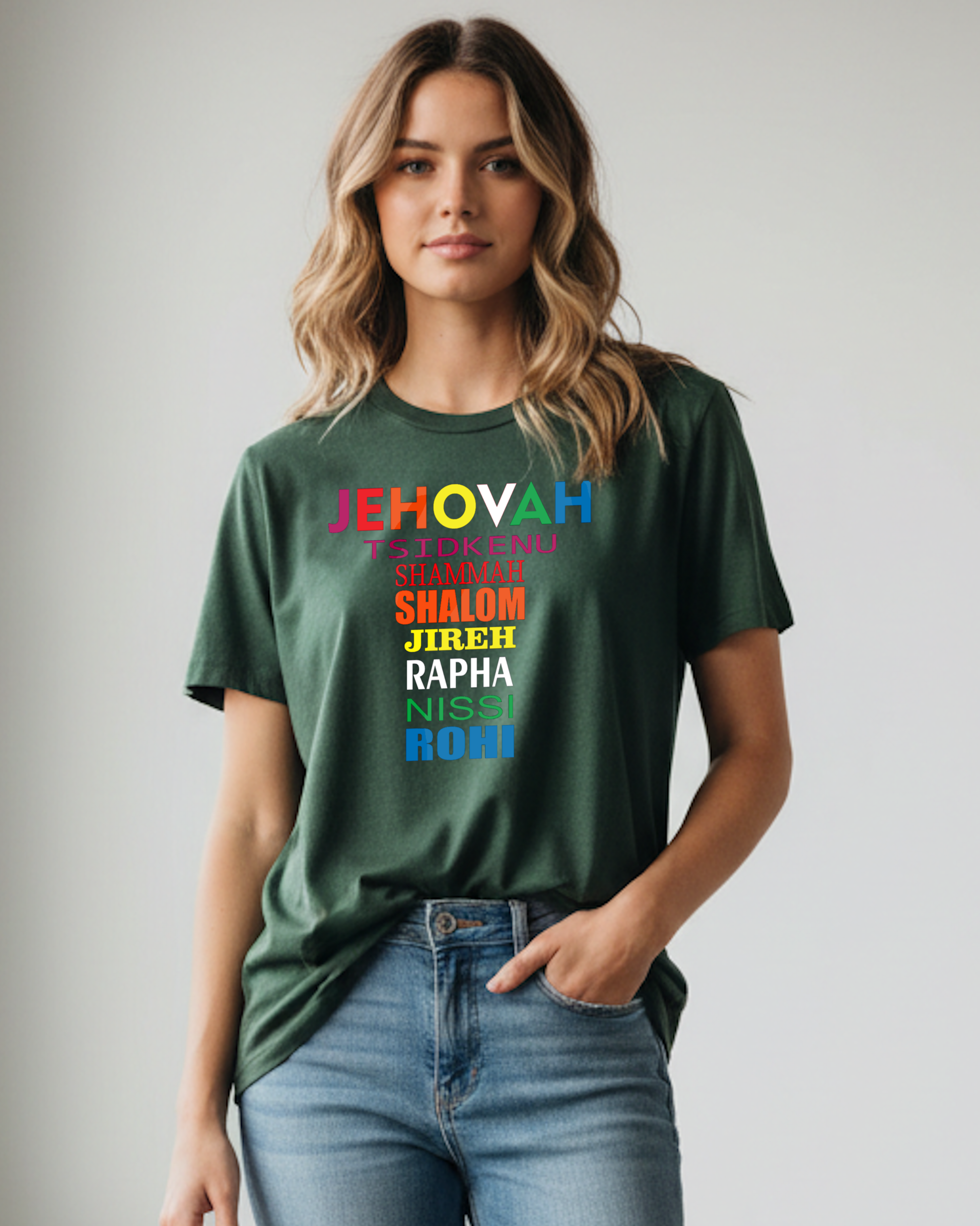 Woman wearing a green t-shirt with colorful text design on a plain background