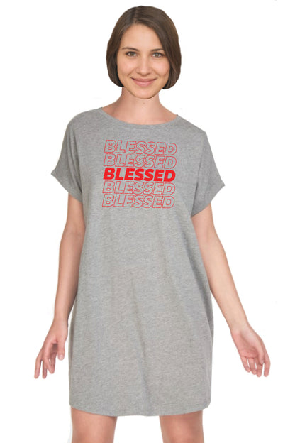 A woman wearing a heather gray short-sleeve t-shirt dress with 'BLESSED' printed in red on the front, set against a plain white background.