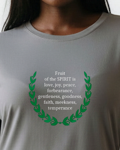 Gray t-shirt with green laurel wreath and white text on a woman wearing it.
