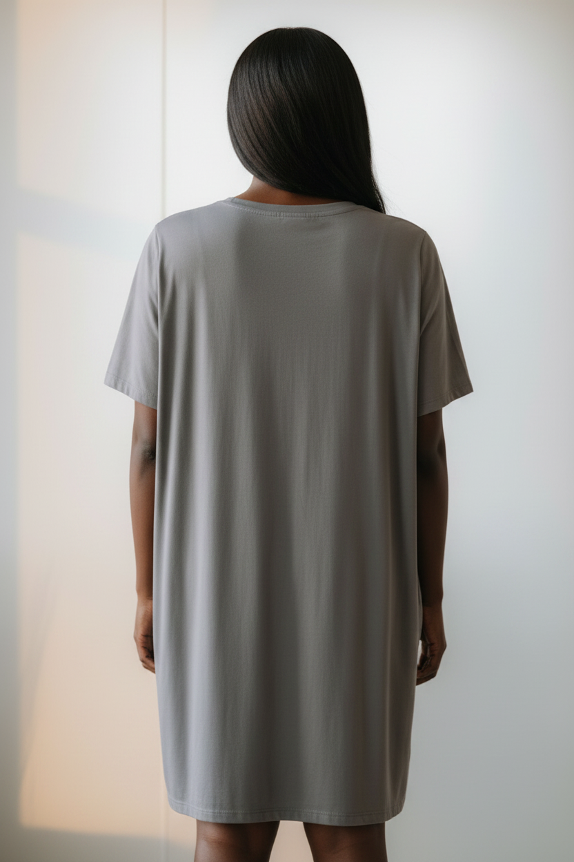 Rear view of a woman earing a grey t-shirt dress