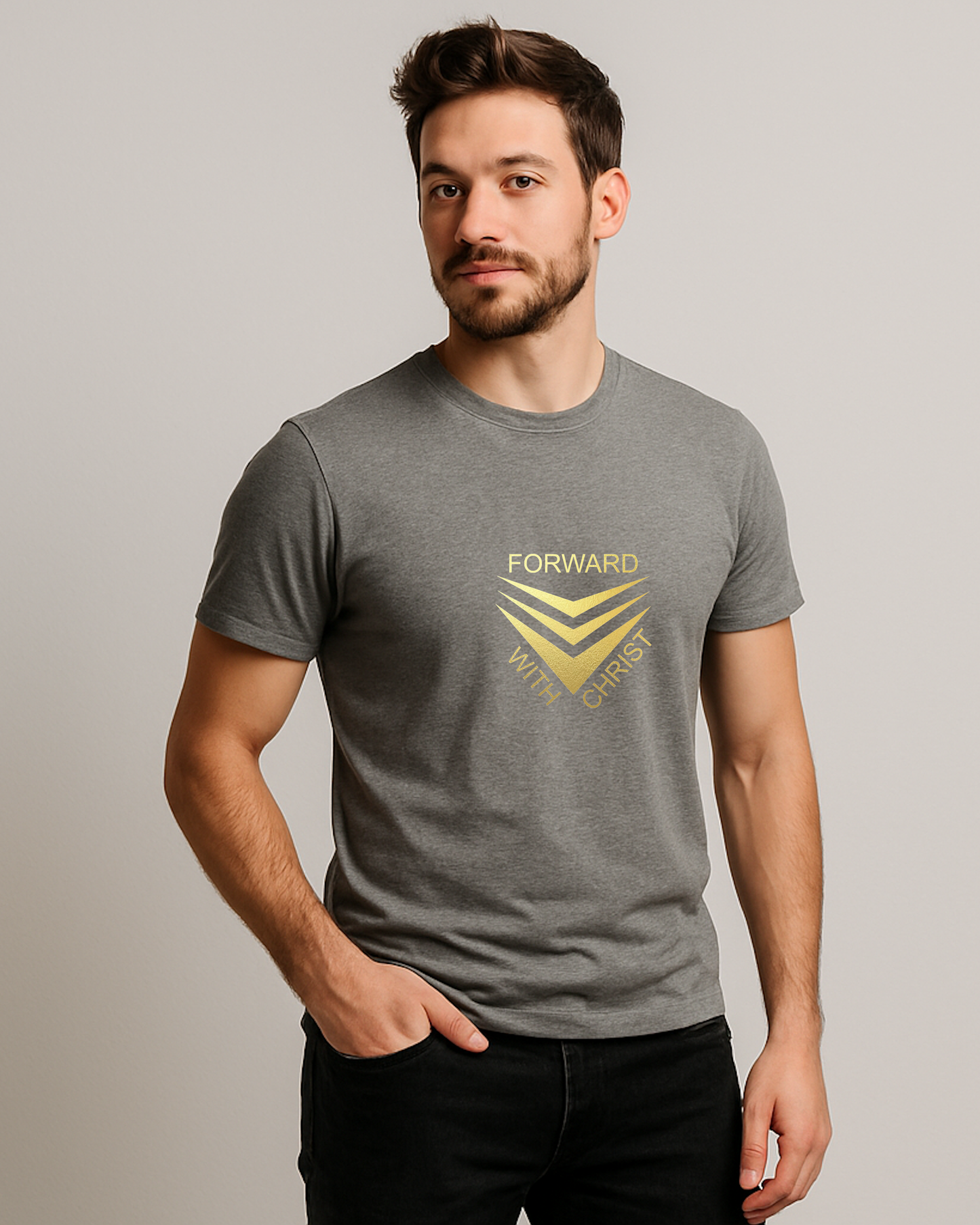A man standing wearing a grey short sleeve t-shirt that has a gold logo with the words "FORWARD WITH CHRIST" around 3 downward pointing chevrons.