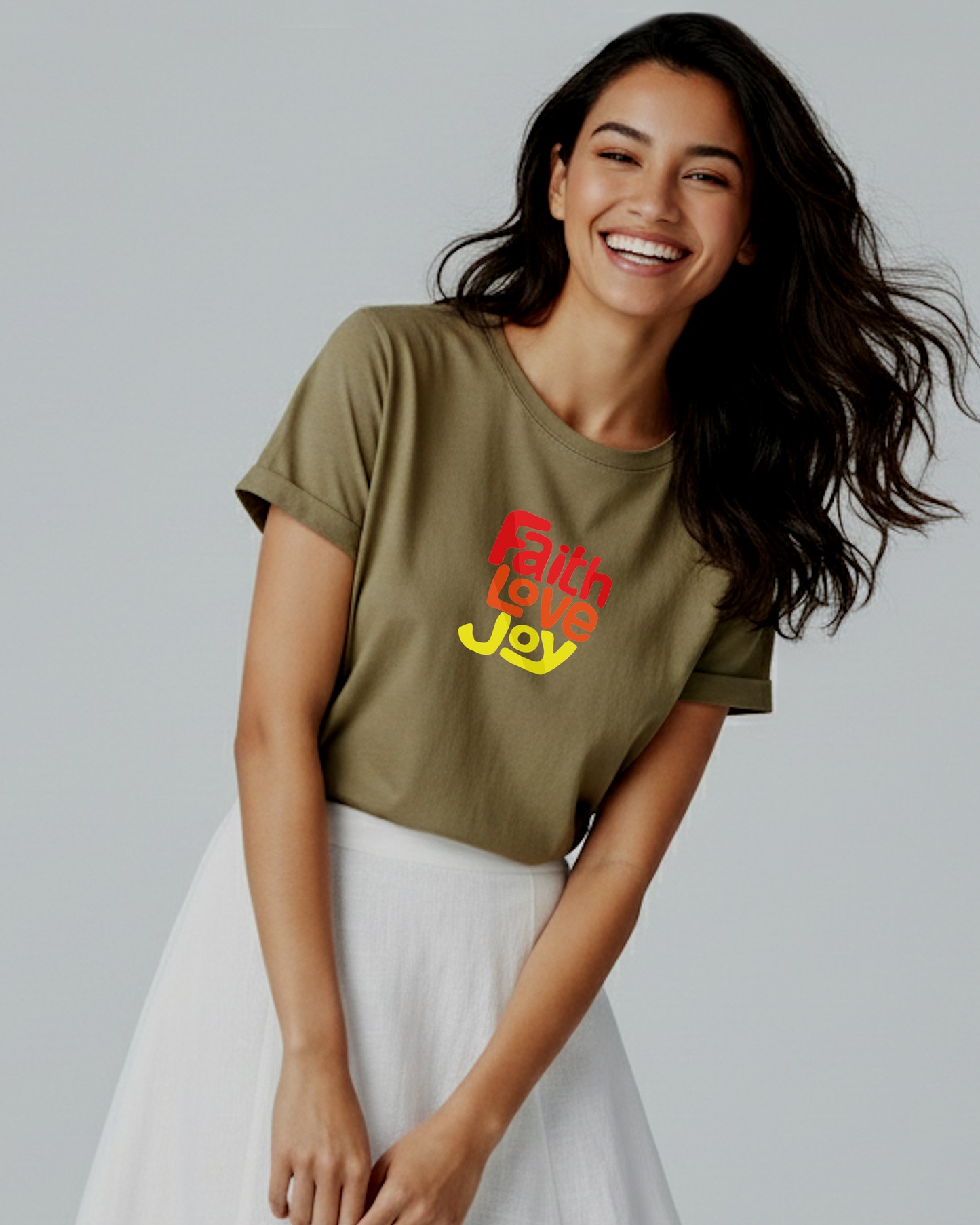 Woman wearing a green t-shirt with 'Faith Love Joy' text on a gray background