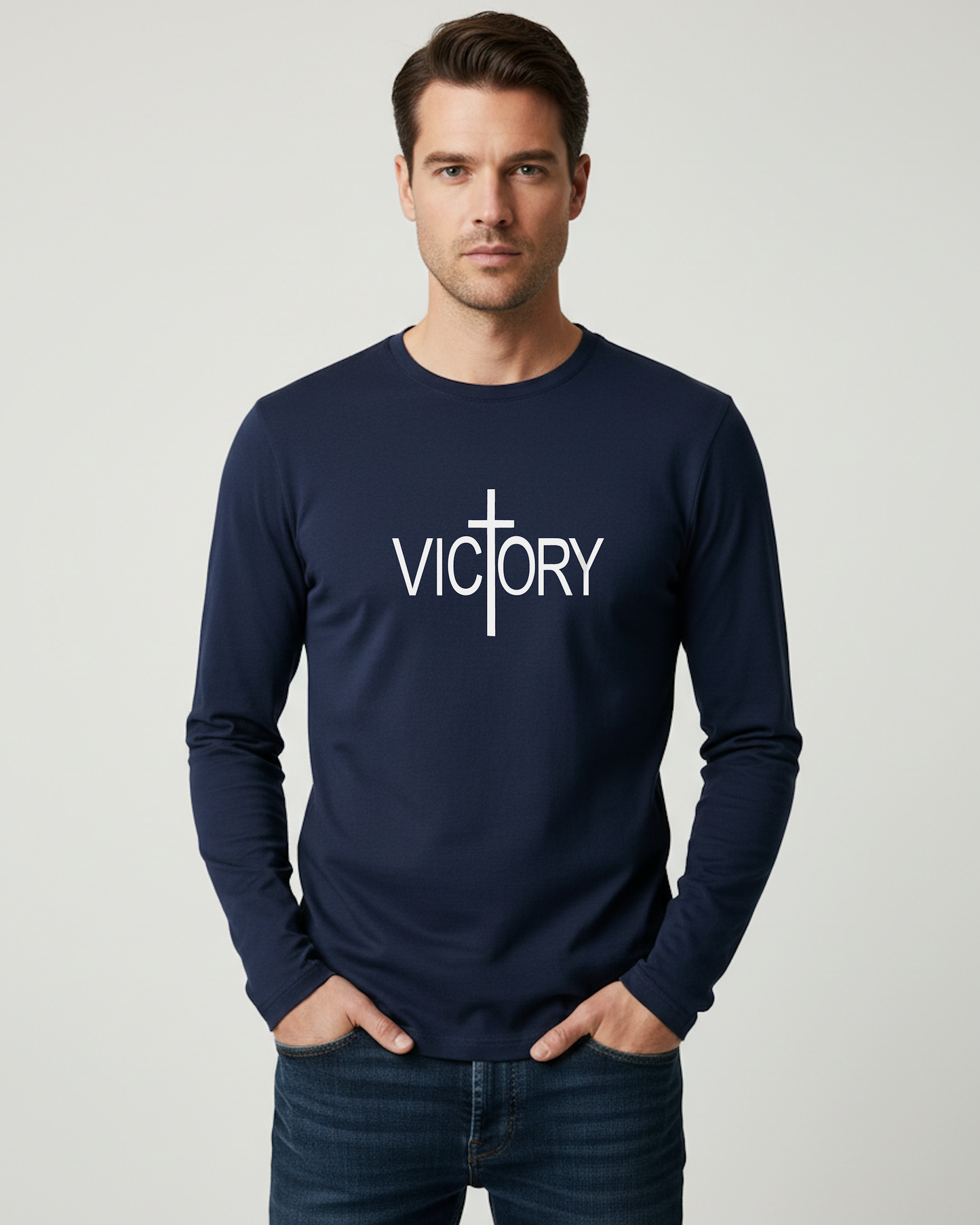 Man wearing a navy blue long-sleeve shirt with 'VICTORY' printed on it against a gray background