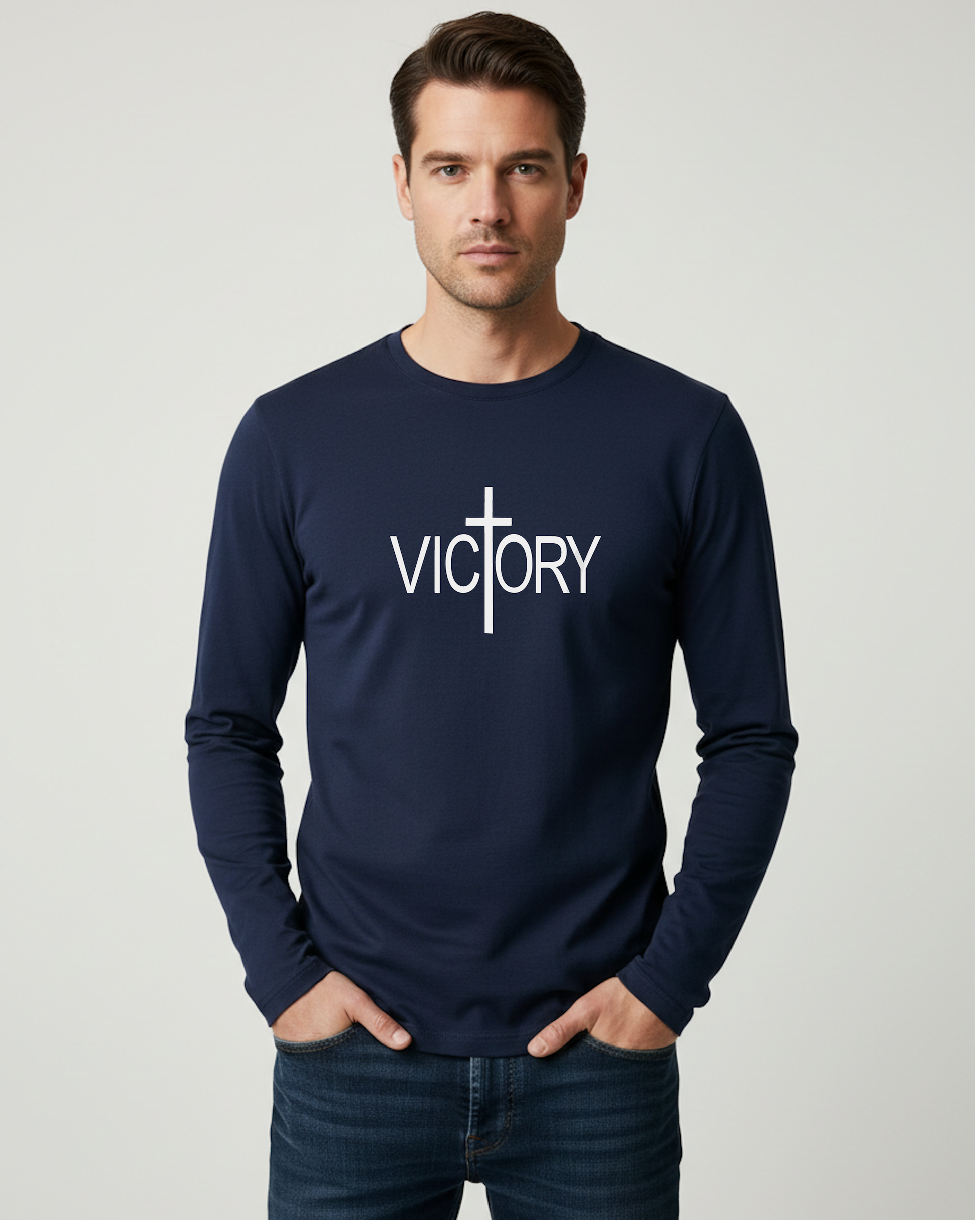 Man wearing a navy blue long-sleeve shirt with 'VICTORY' printed on it against a gray background