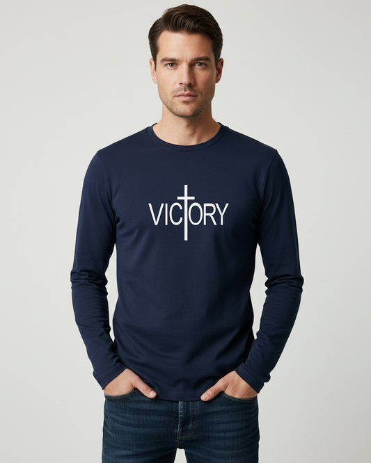 Man wearing a navy blue long-sleeve shirt with 'VICTORY' printed on it against a gray background