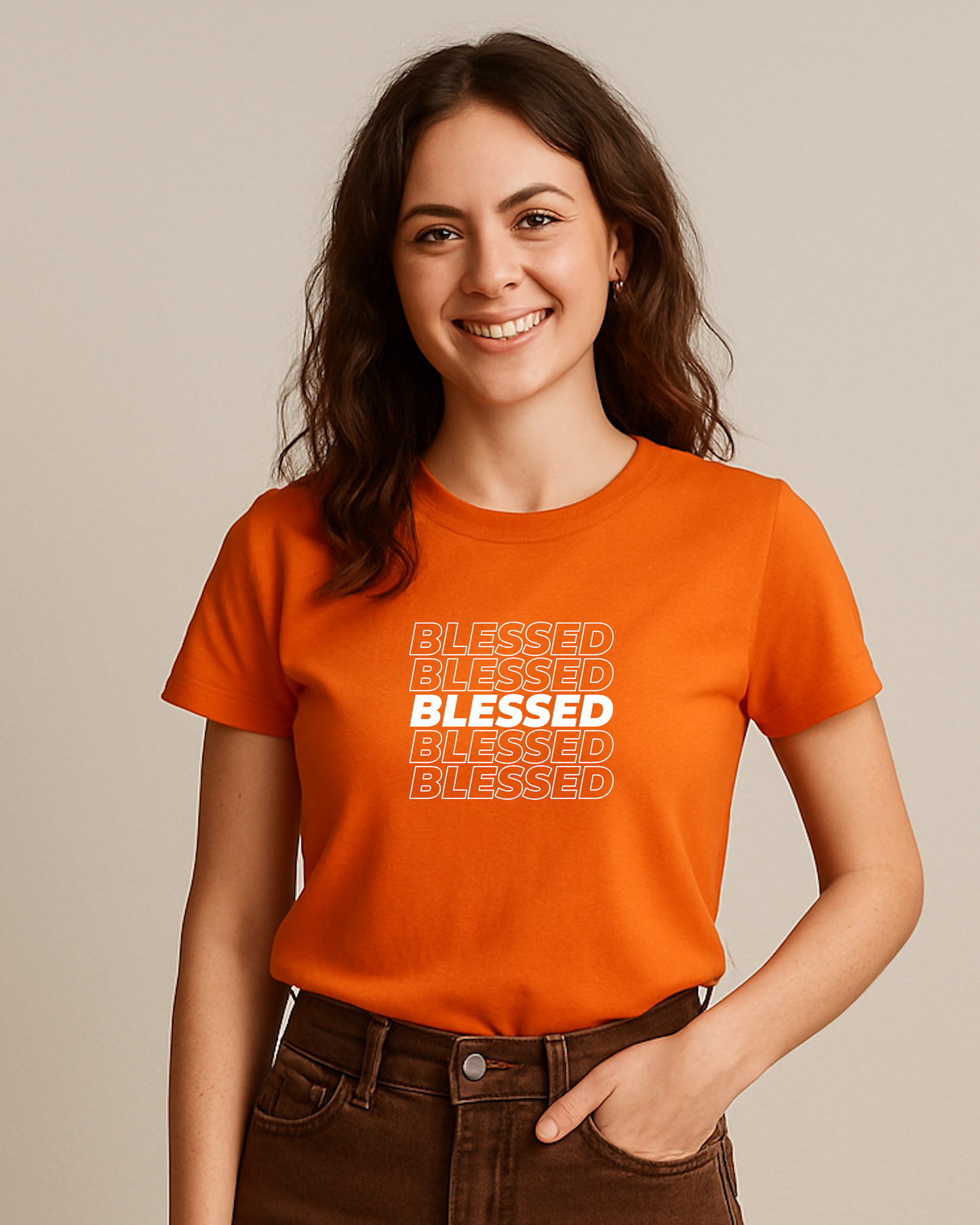 A young woman wearing an orange t-shirt with multiple lines of "Blessed" text printed on the front.