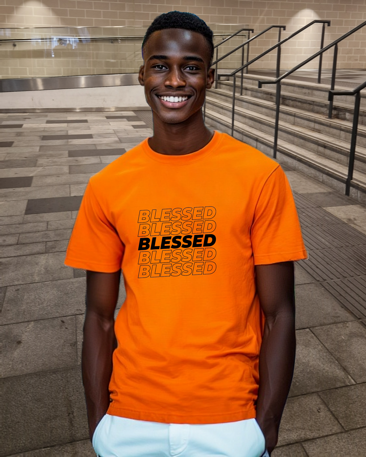 A young man in a shopping mall wearing an orange t-shirt with multiple lines of "Blessed" text printed on the front.