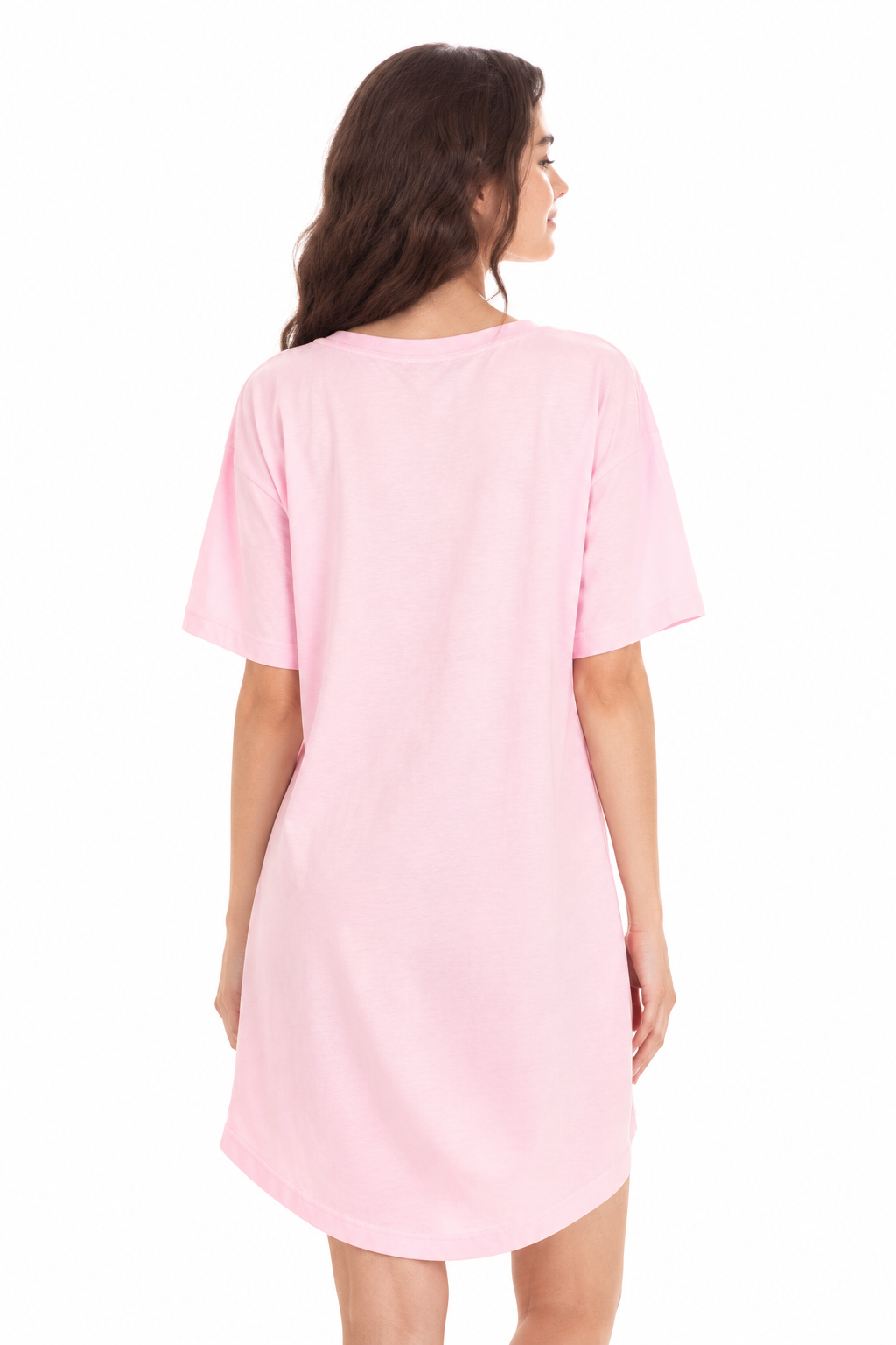 A woman shown from the back wearing an oversized light pink short-sleeve t-shirt dress against a plain white background.