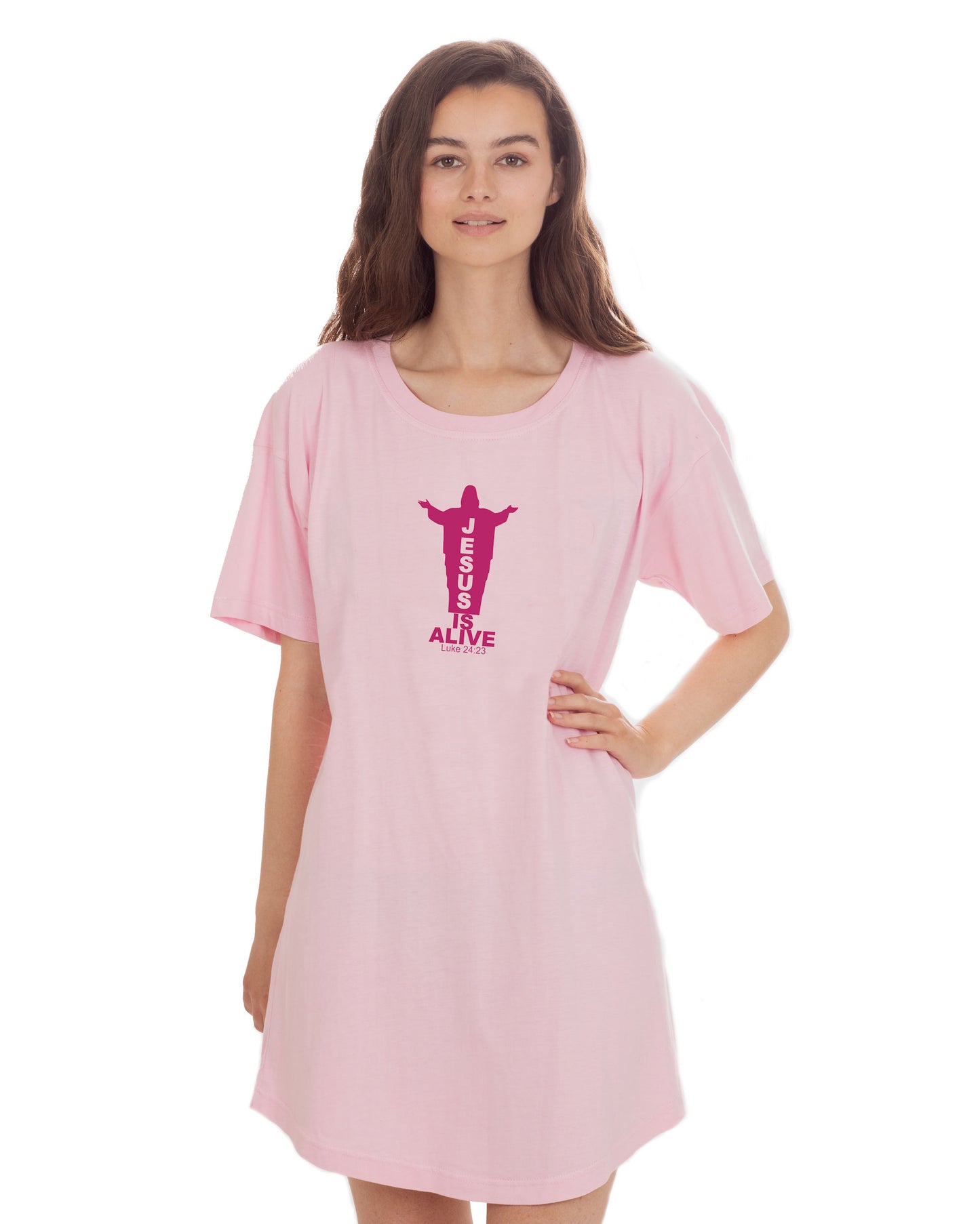 Woman wearing a pink t-shirt dress with a red Jesus silhouette graphic and text against a white background.