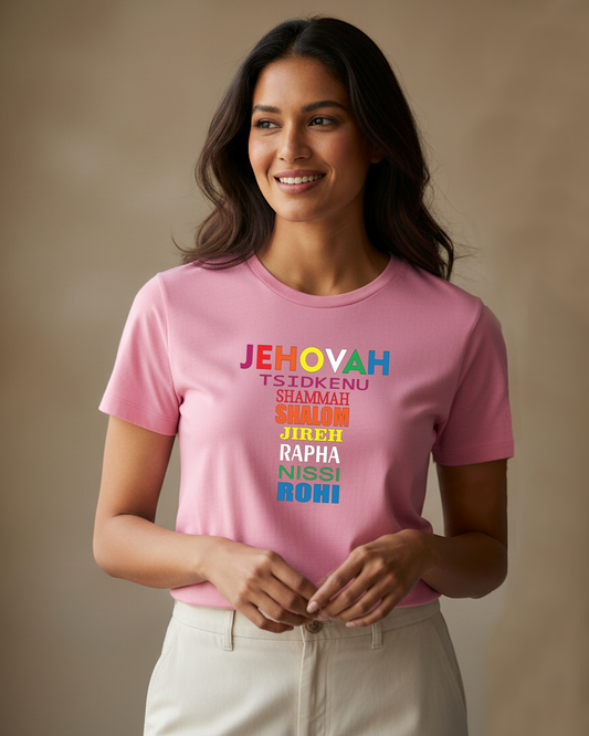 Woman wearing a pink t-shirt with colorful Hebrew text against a plain beige background