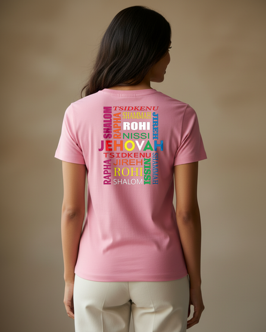 Woman wearing a pink t-shirt with colorful Hebrew text against a plain beige background