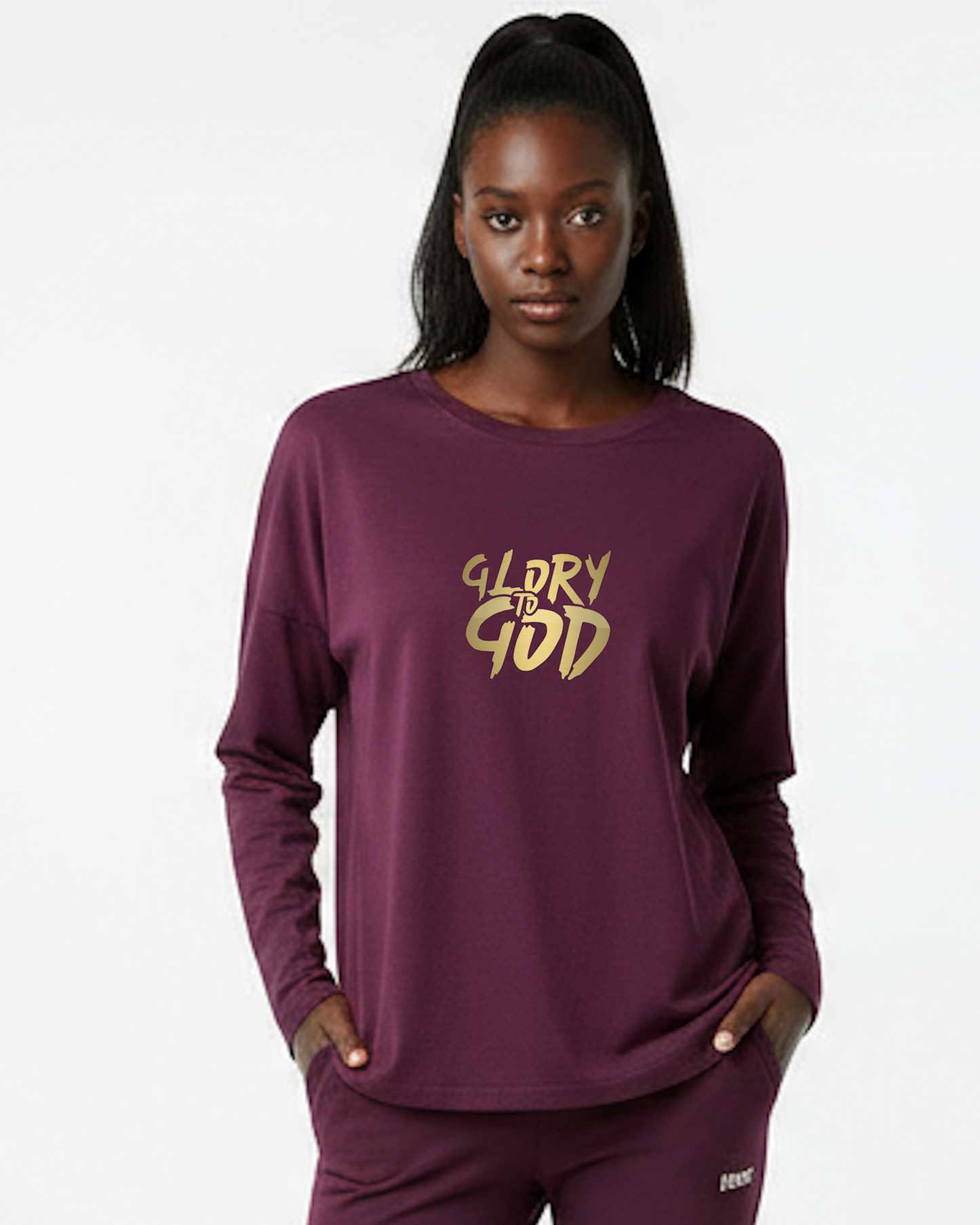 Woman wearing a purple long-sleeve shirt with 'Glory to God' text on a white background