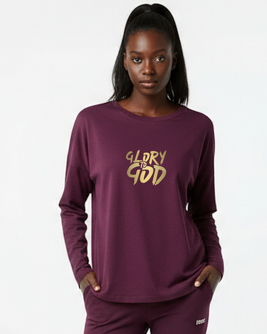Woman wearing a purple long-sleeve shirt with 'Glory to God' text on a white background