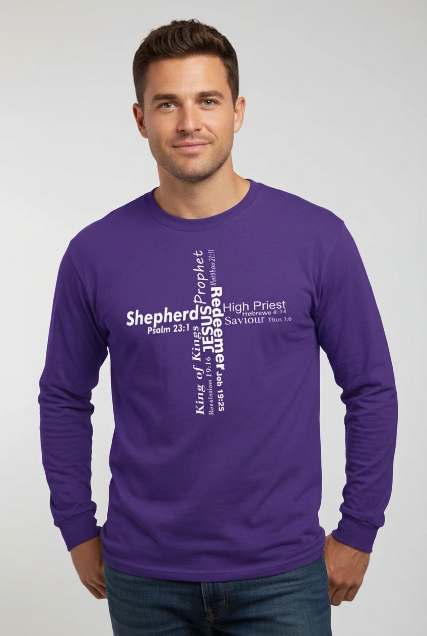 A man wearing purple long-sleeve crewneck t-shirt against a light gray wall. The front of the shirt features a white typographic cross design with the various roles of Jesus.