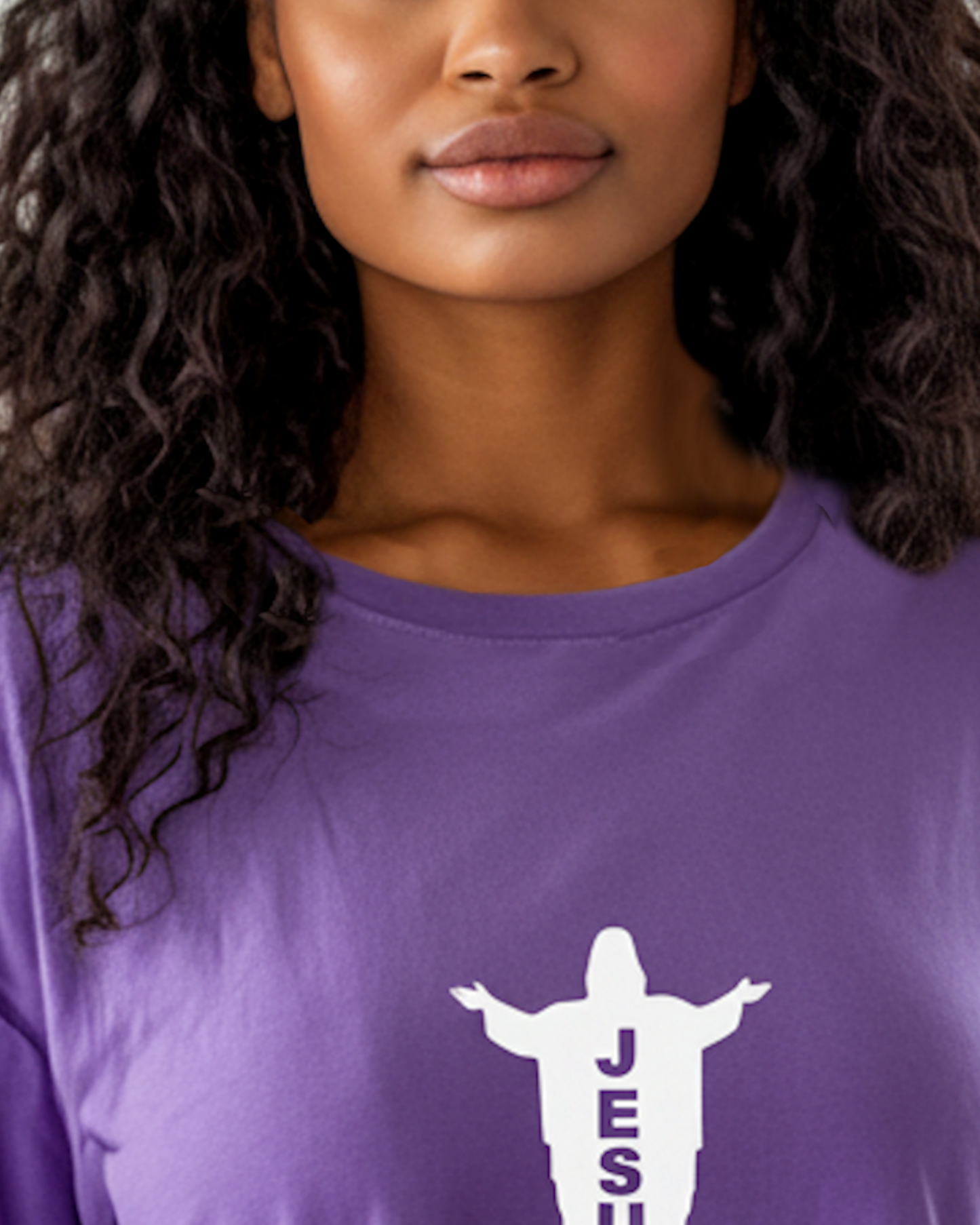 Closeup view of neclkline of a woman wearing a purple t-shirt dress with white graphic.