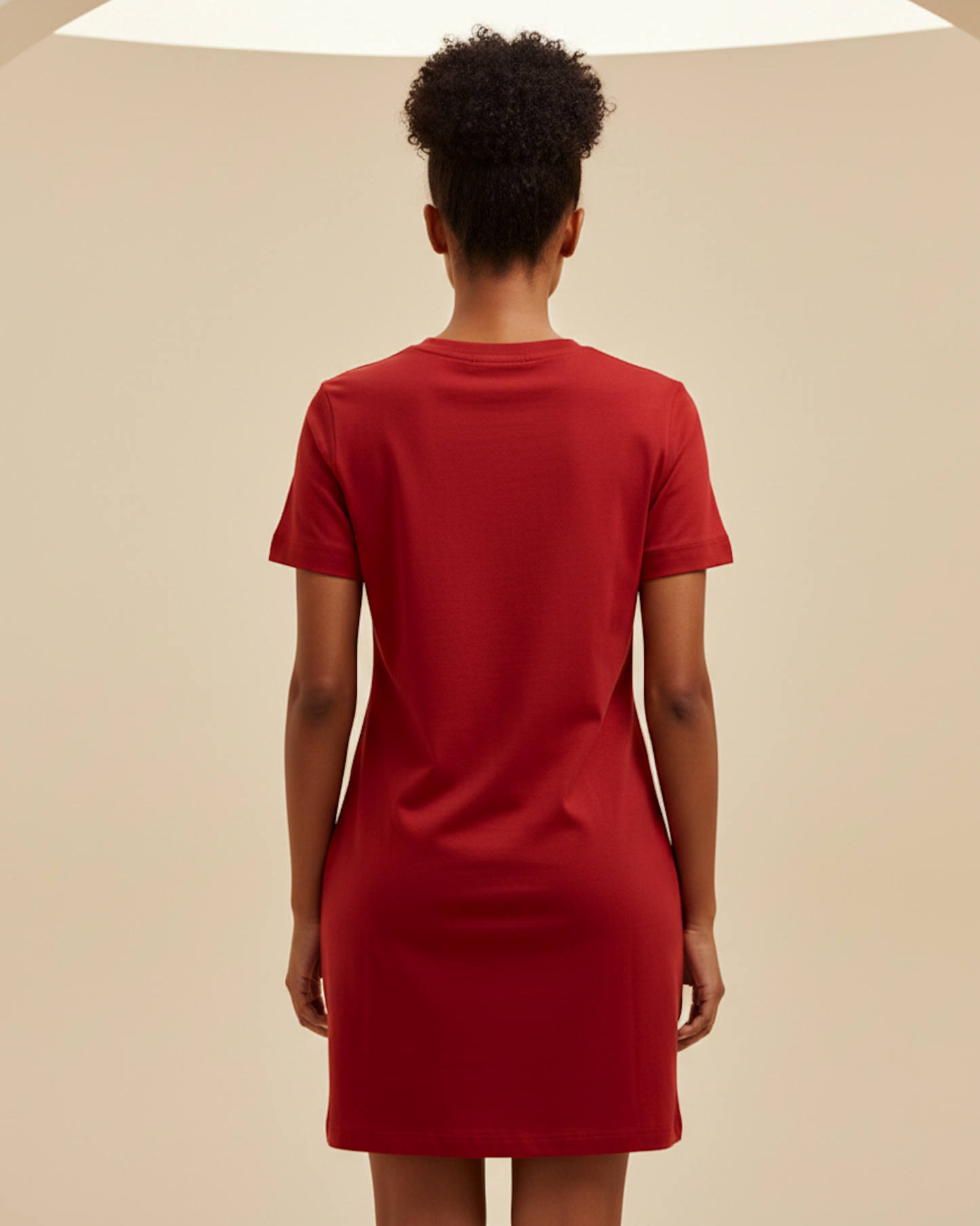 Rear view of a woman wearing a red t-shirt dress.