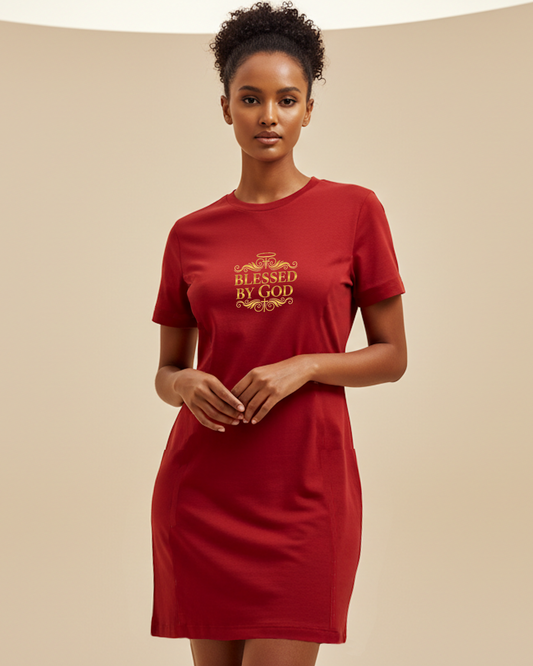Woman wearing a red t-shirt dress with 'Blessed by God' text in gold, against a beige background.