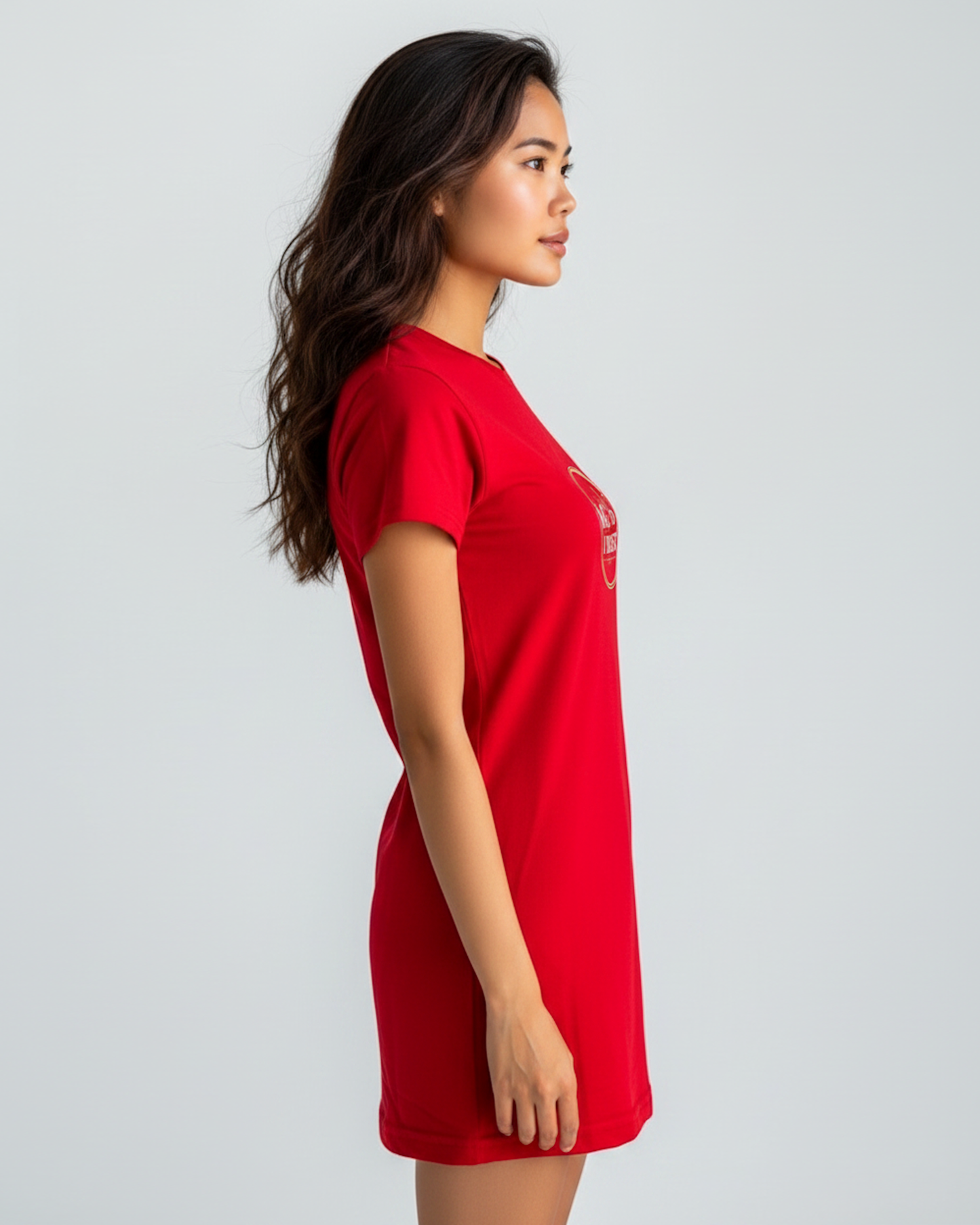 Side view of a Woman wearing a red t-shirt dress on a white background.