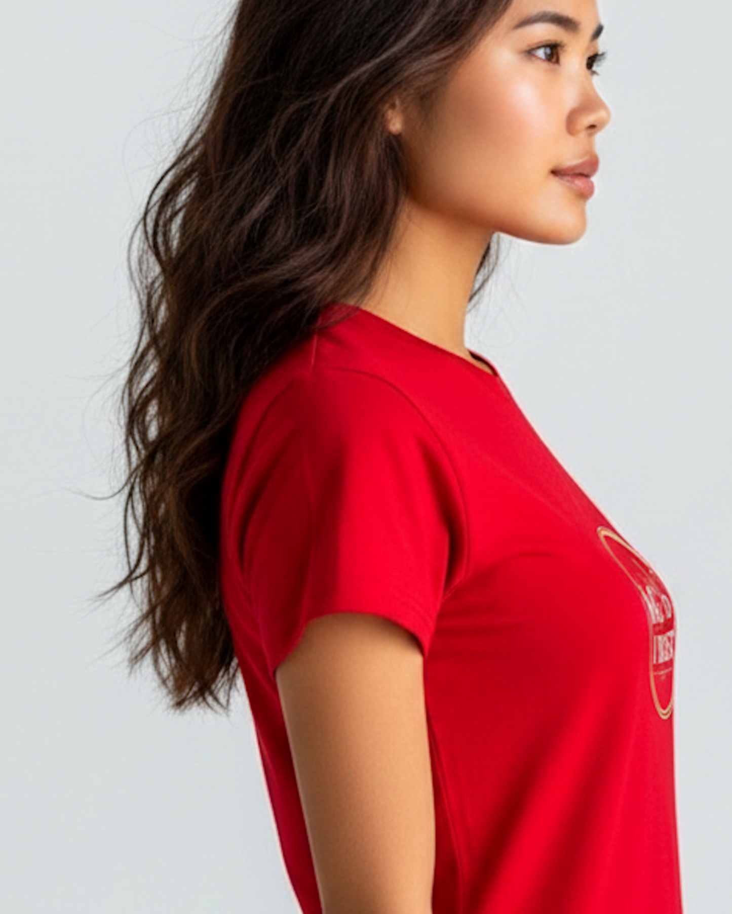Closeup of a woman wearing a red t-shirt dress showing the right sleeve.