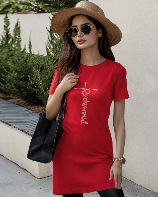 A woman in a mall wearing a red Heavenly Dreamwear t-shirt dress with an elaborate white 'Redeemed' logo printed on the front. 