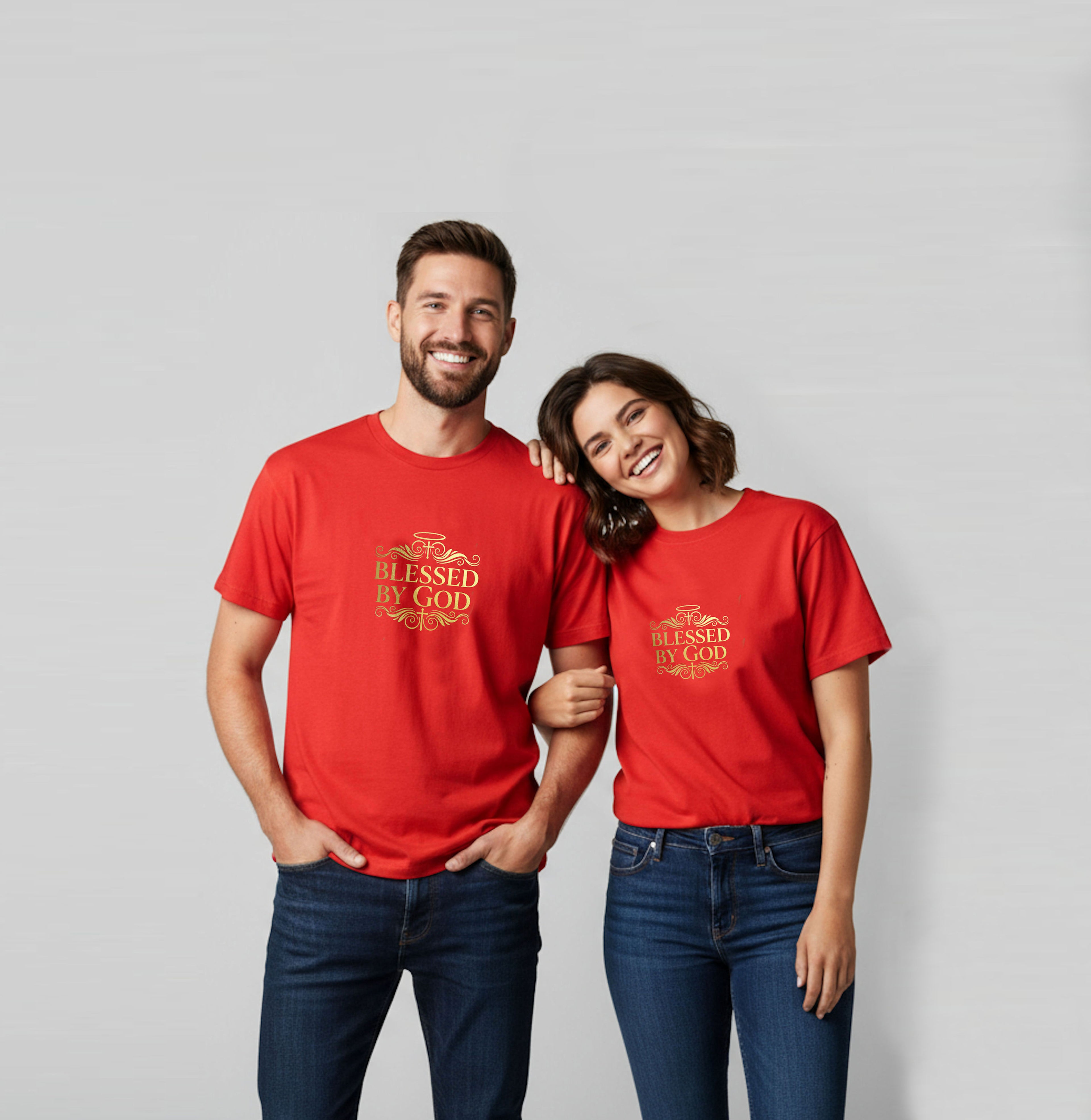A couple wearing red short sleeve t-shirts with a gold "Blessed By God" logo against a pale grey background.
