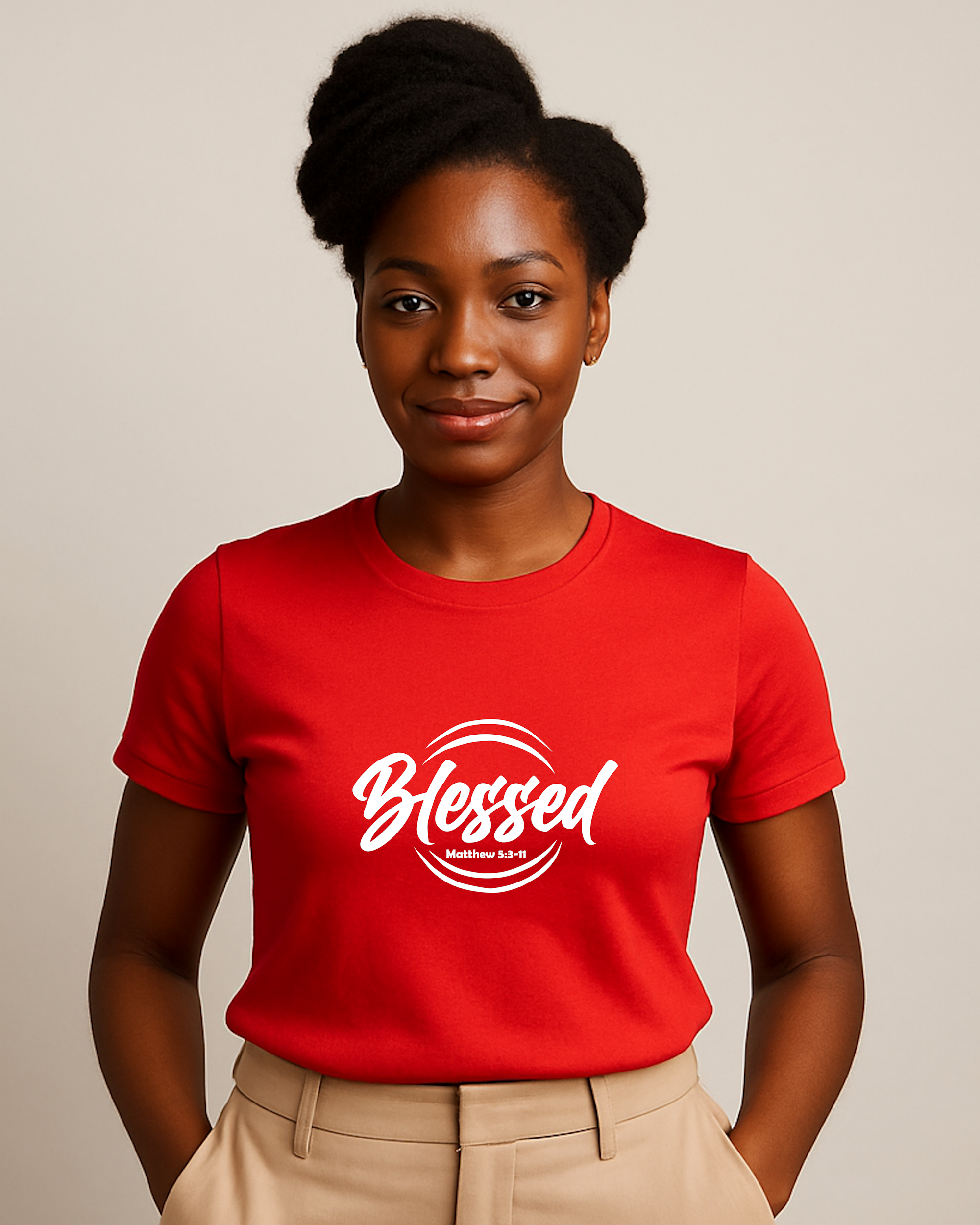 A young woman wearing a red t-shirt with a white text logo that says 'Blessed' 