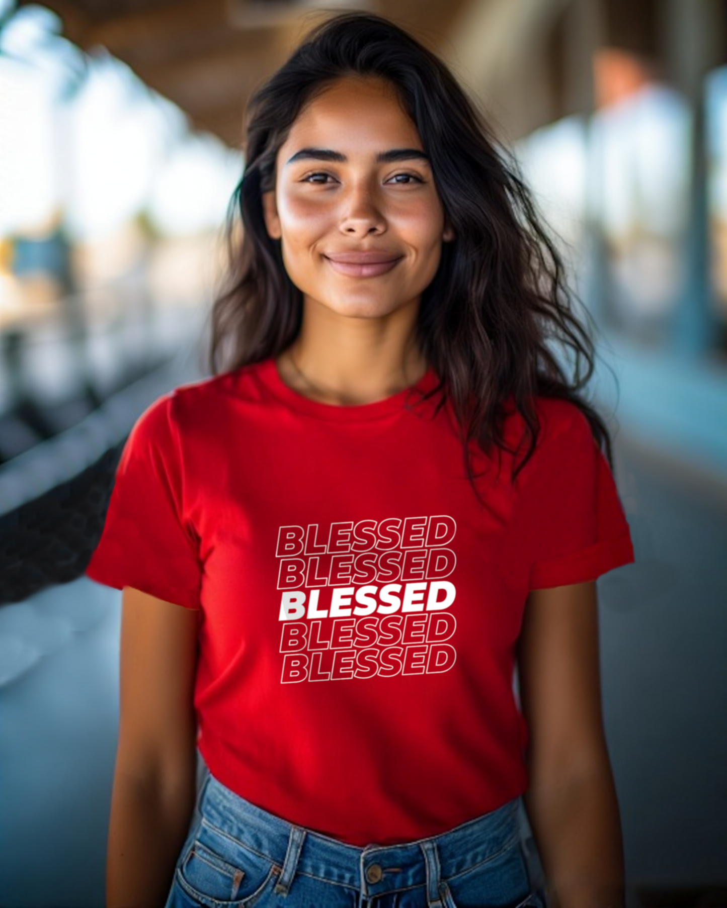 A young woman in a bright corridor wearing a red t-shirt with multiple lines of "Blessed" text printed on the front.