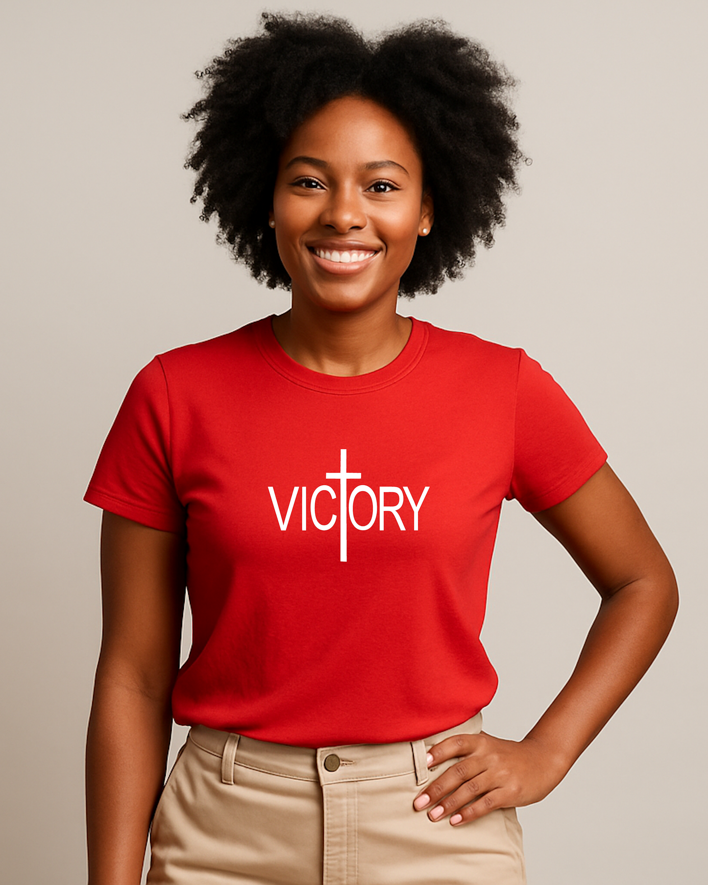 A woman wearing a red t-shirt with a white Heavenly Dreamwear "Victory" logo printed on the front.