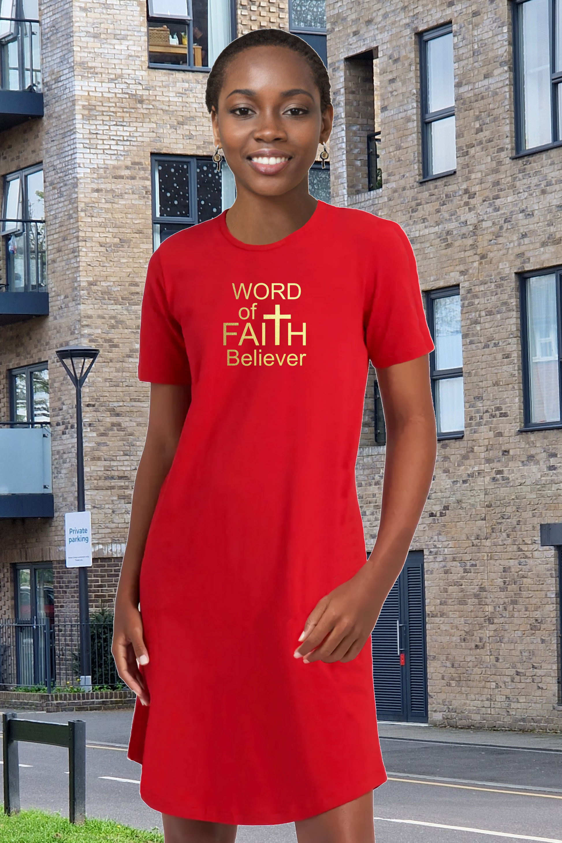 Woman wearing a red Heavenly Dreamwear t-shirt dress with the text "Word of Faith Believer" in gold.