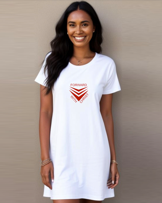 A woman standing in against a wall wearing a white Heavenly Dreamwear t-shirt dress with a red logo made up of  3 chevrons surrounded by the text, "Forward With Christ".