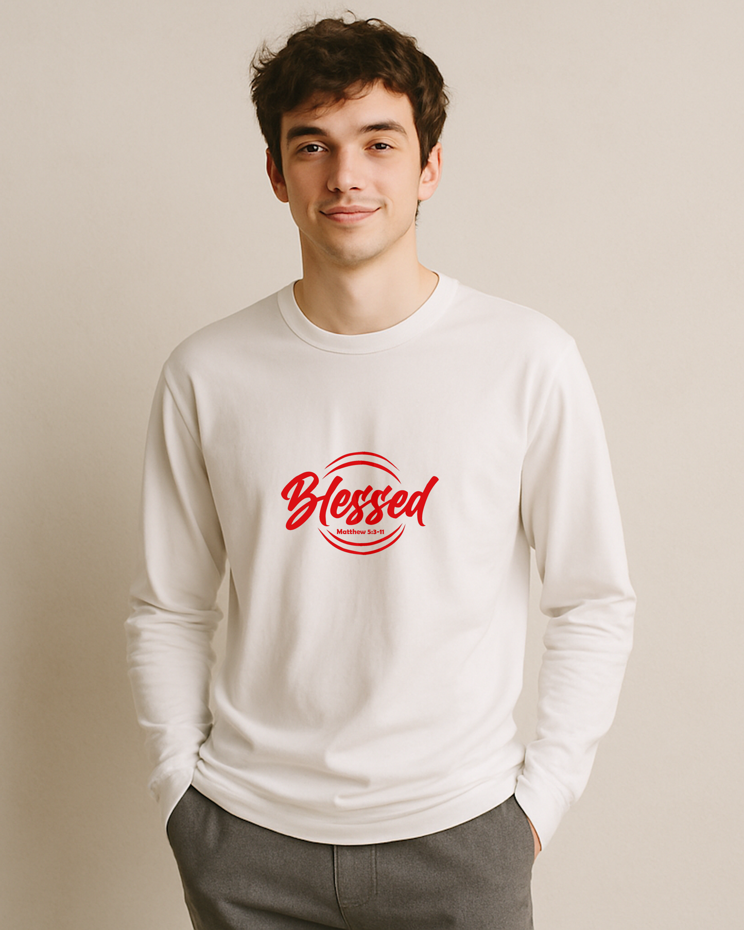 A man wearing a white long sleeve T-shirt with 'Blessed' printed in red on a beige background