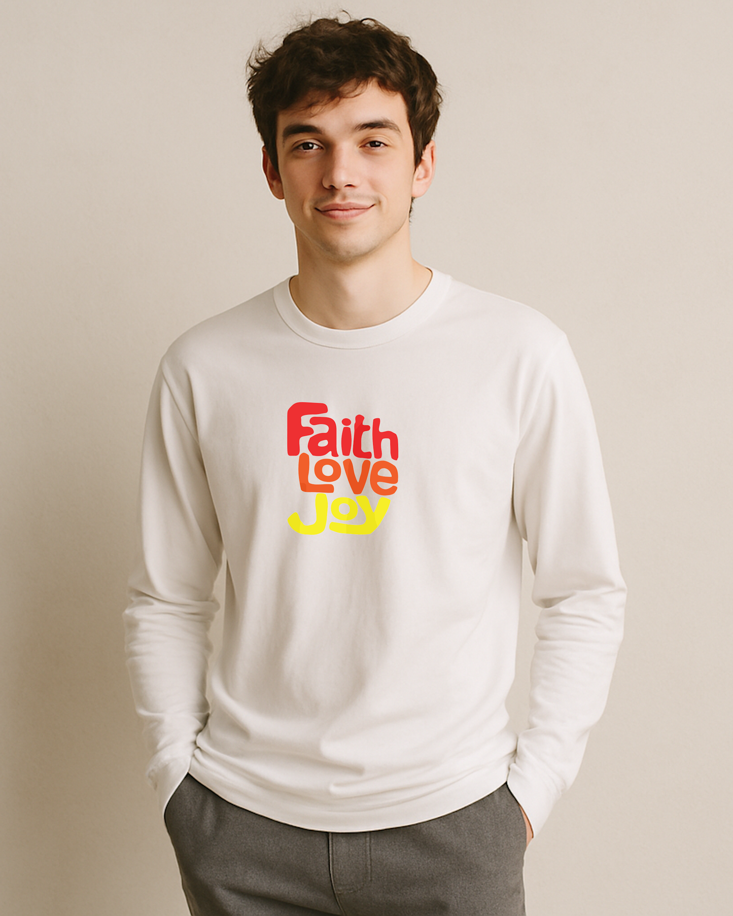 Man wearing a white sweatshirt with 'Faith Love Joy' text on a beige background
