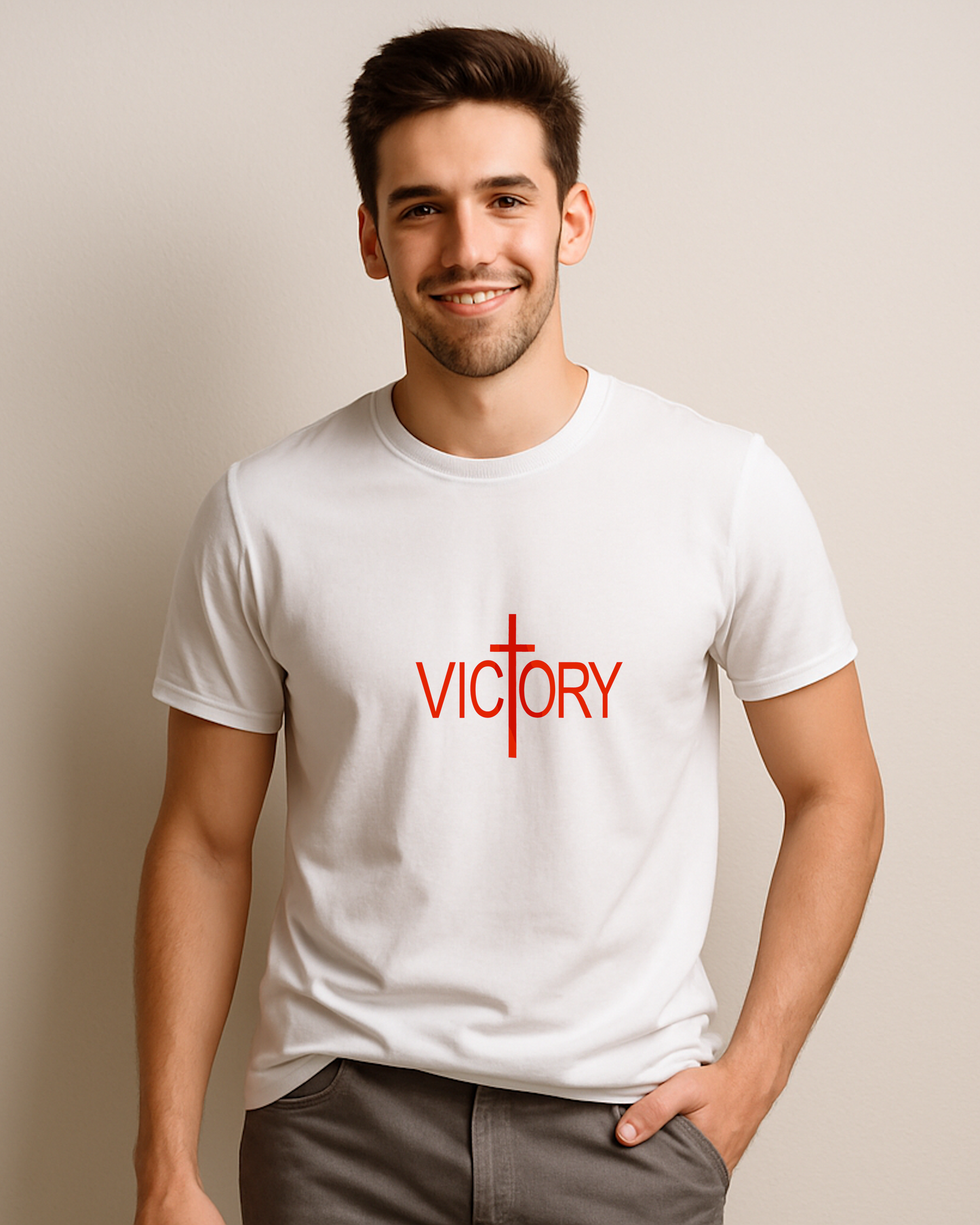 A man dressed in a white t-shirt featuring a red logo with the word "Victory" printed boldly on the front.
