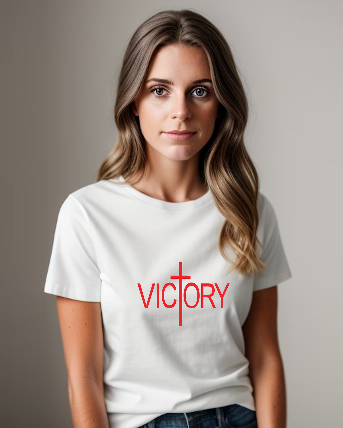 A woman dressed in a white t-shirt featuring a red logo with the word "Victory" printed boldly on the front.