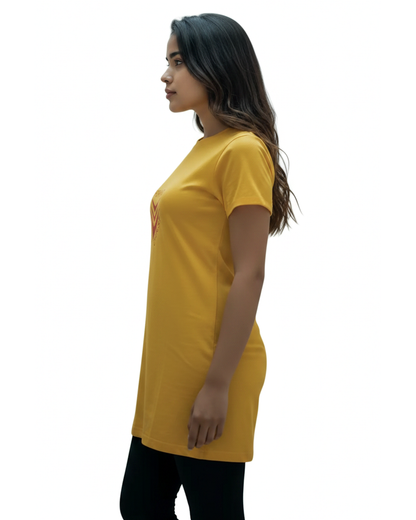 Side view of a woman wearing a yellow t-shirt dress with a red logo against a white background.