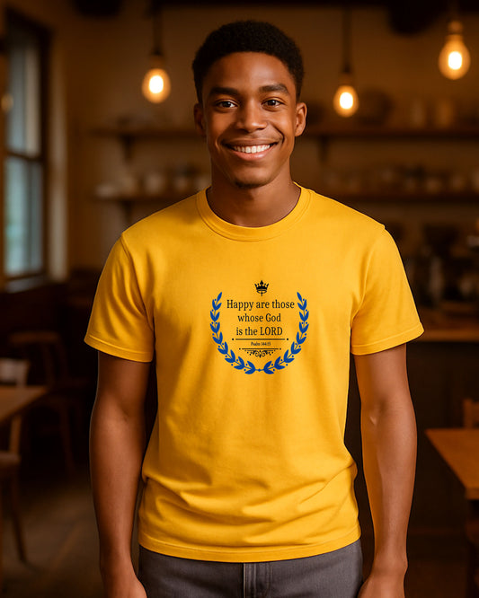 Man wearing a yellow t-shirt with a black text and blue laurel graphic design indoors