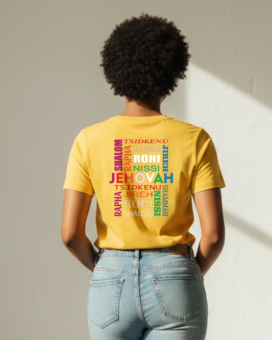 Woman wearing a yellow short sleeve t-shirt with a multi-colored text logo printed on the back against a white wall